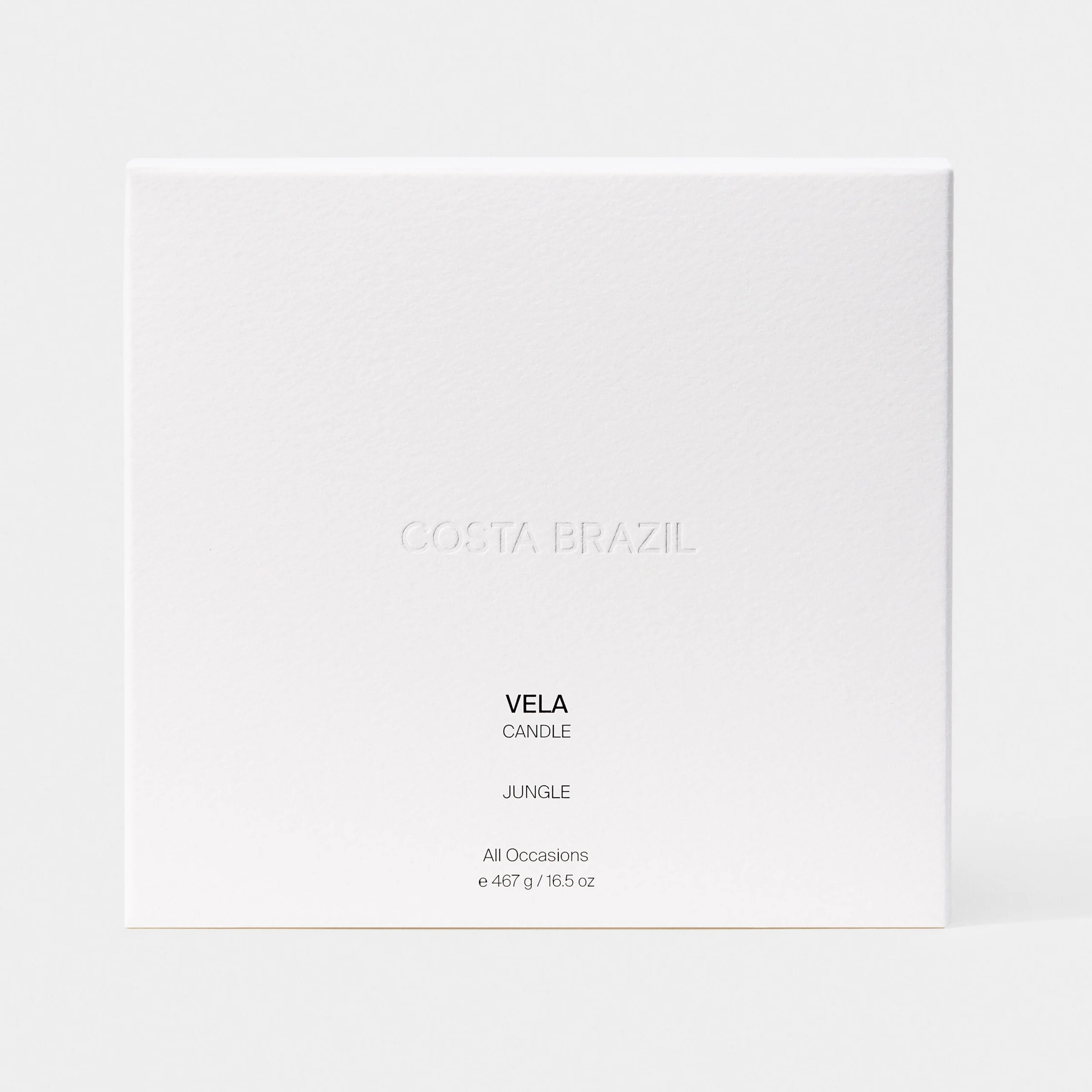 White textured candle box with embossed logo, labelled Vela Candle Jungle, on a pale grey backdrop, for Costa Brazil.
