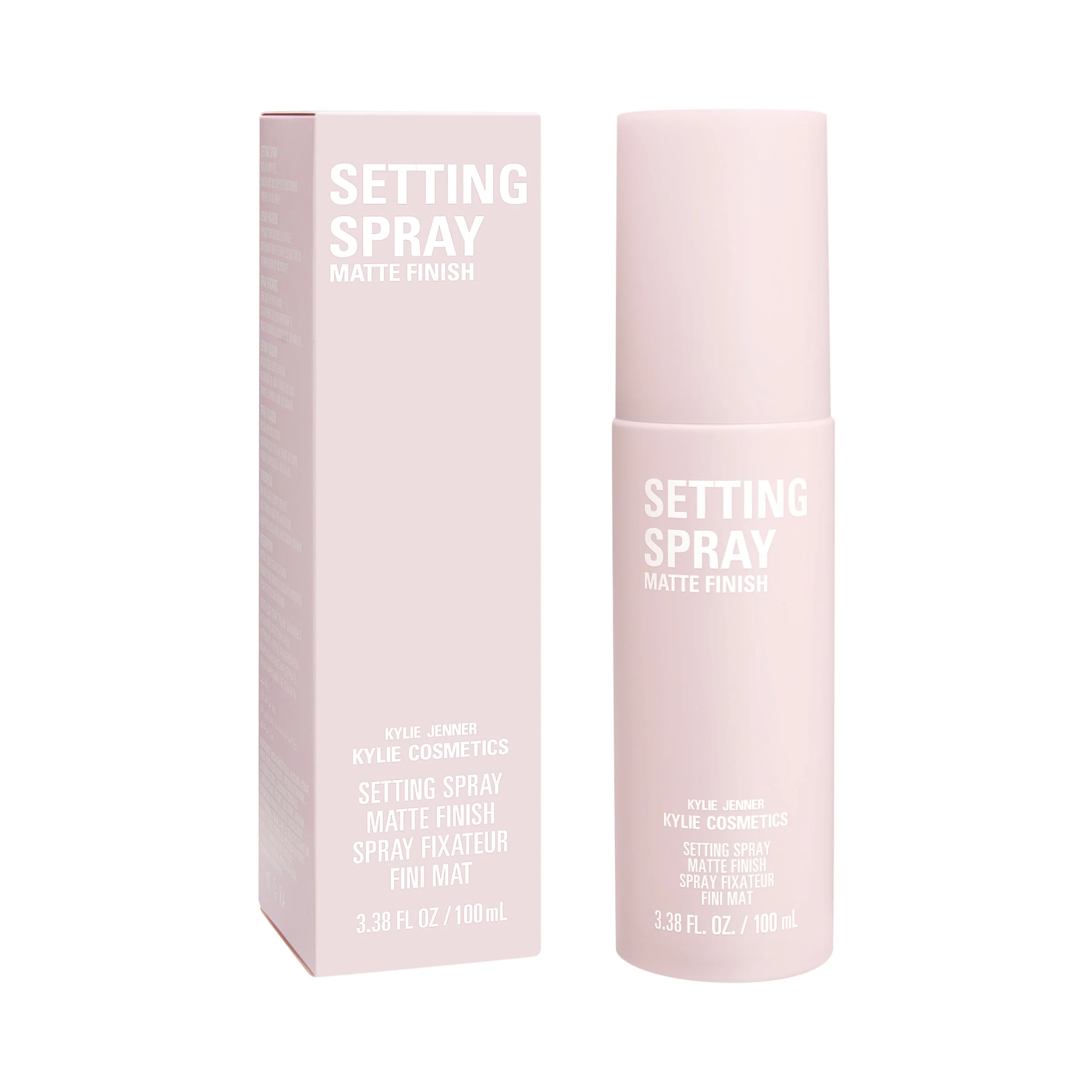 Pale pink matte finish setting spray bottle beside its matching box on a white background, for Kylie Cosmetics.